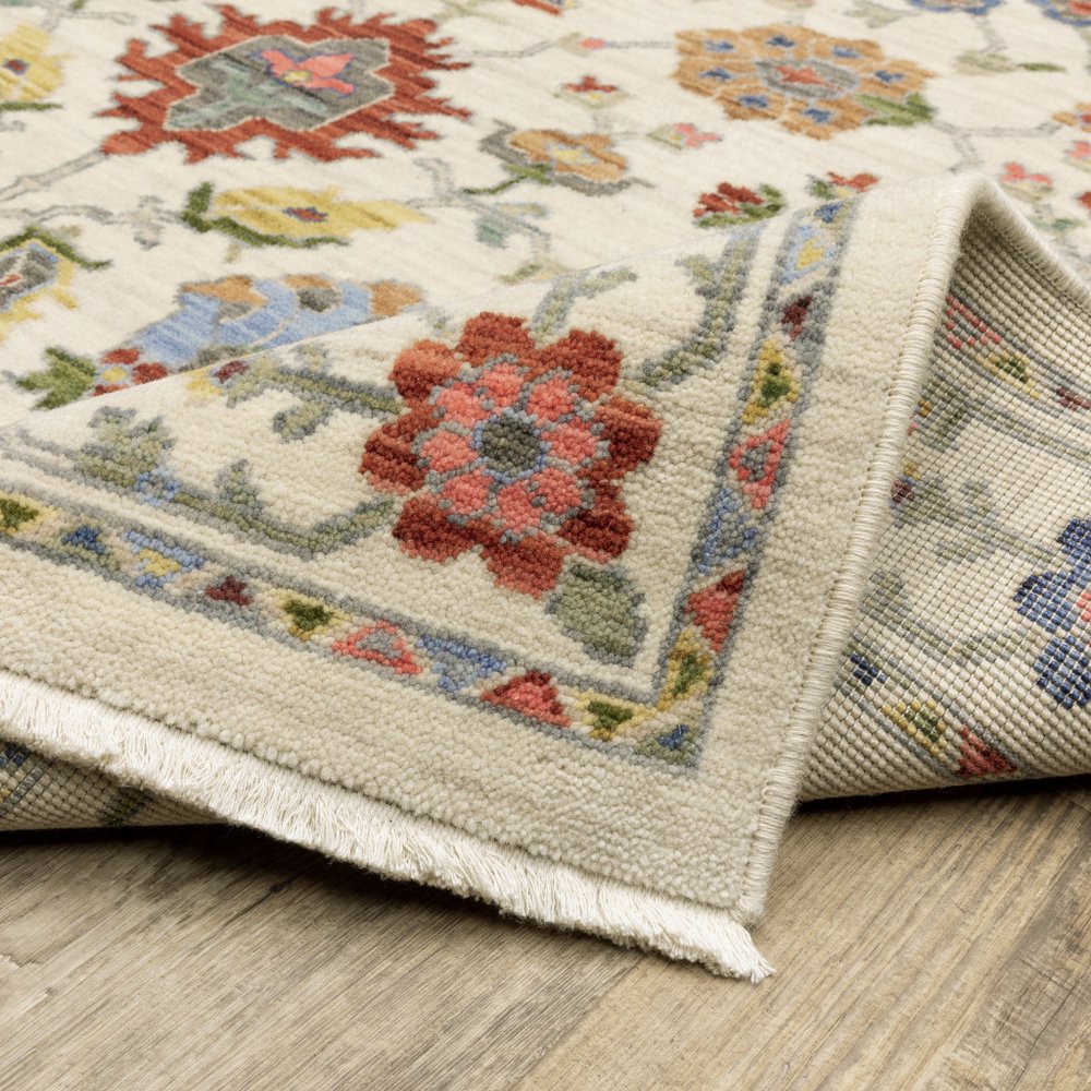 5' X 8' Ivory Blue And Red Oriental Area Rug With Fringe