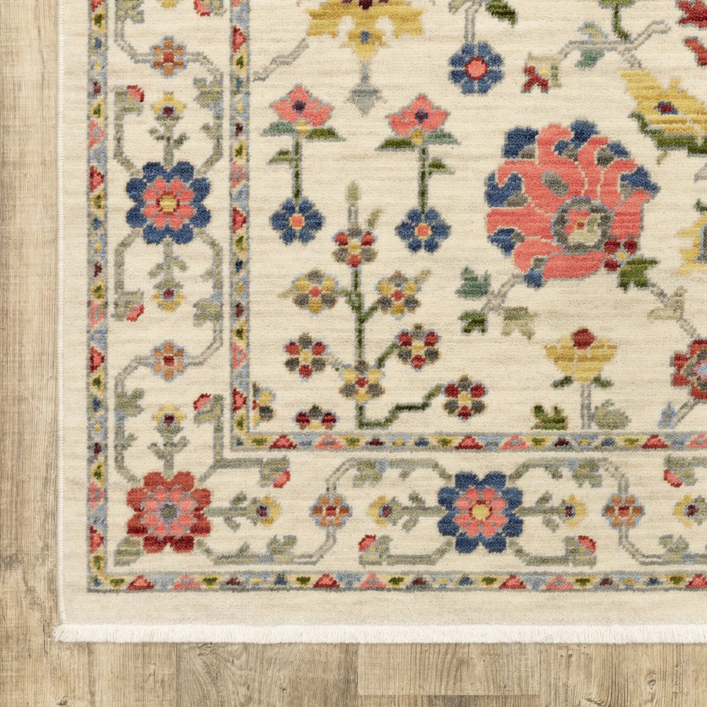 6' X 9' Ivory Salmon Pink Gold Blues Grey Rust And Green Oriental Power Loom Stain Resistant Area Rug With Fringe