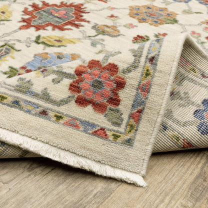 6' X 9' Ivory Salmon Pink Gold Blues Grey Rust And Green Oriental Power Loom Stain Resistant Area Rug With Fringe