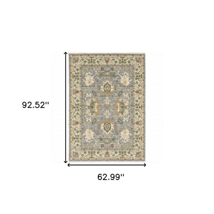 5' X 8' Blue And Ivory Oriental Power Loom Stain Resistant Area Rug With Fringe