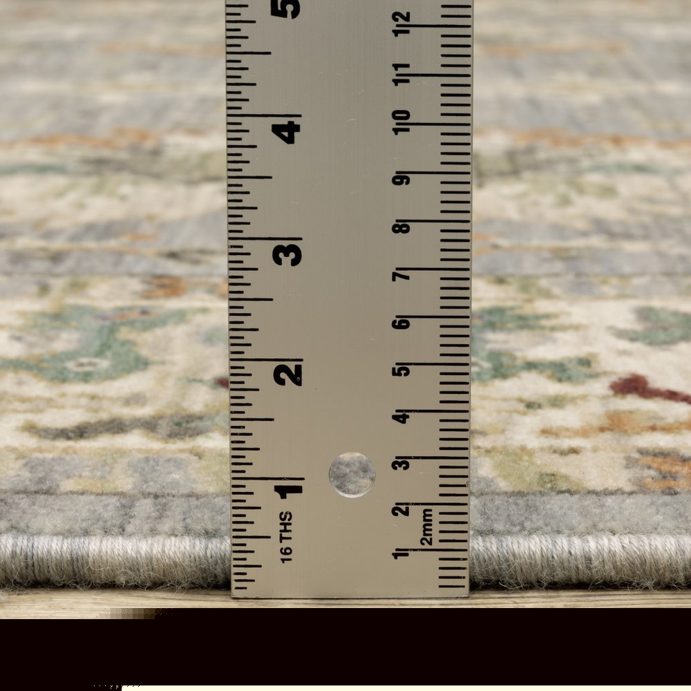5' X 8' Blue And Ivory Oriental Power Loom Stain Resistant Area Rug With Fringe