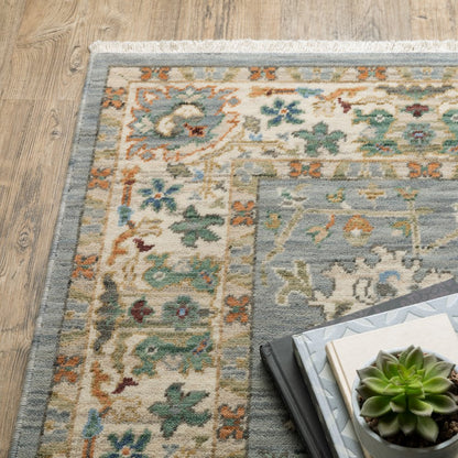 8' X 11' Grey Ivory Orange Teal Green Charcoal Blue And Red Oriental Power Loom Stain Resistant Area Rug With Fringe