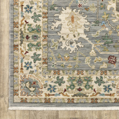 8' X 11' Grey Ivory Orange Teal Green Charcoal Blue And Red Oriental Power Loom Stain Resistant Area Rug With Fringe