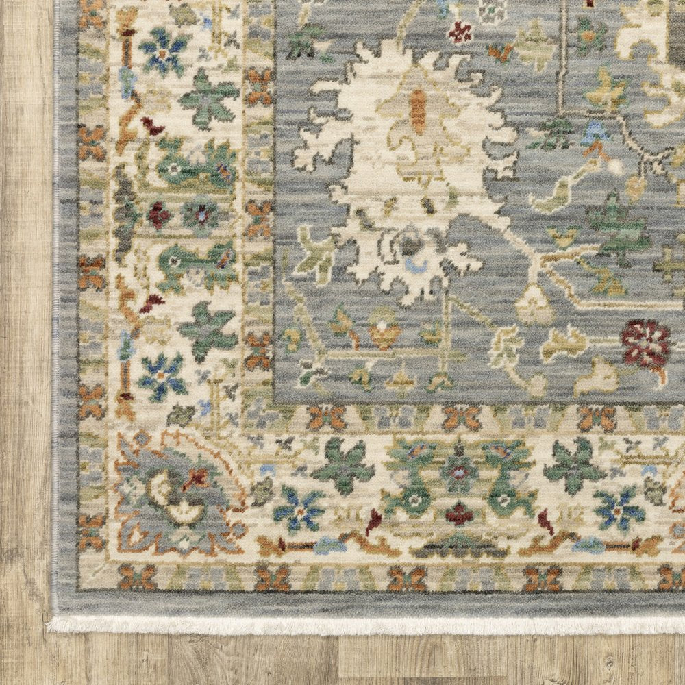 8' X 11' Grey Ivory Orange Teal Green Charcoal Blue And Red Oriental Power Loom Stain Resistant Area Rug With Fringe