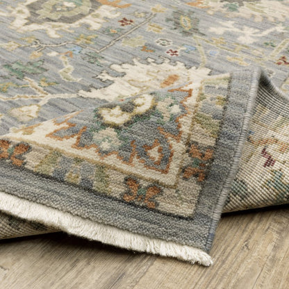 8' X 11' Grey Ivory Orange Teal Green Charcoal Blue And Red Oriental Power Loom Stain Resistant Area Rug With Fringe