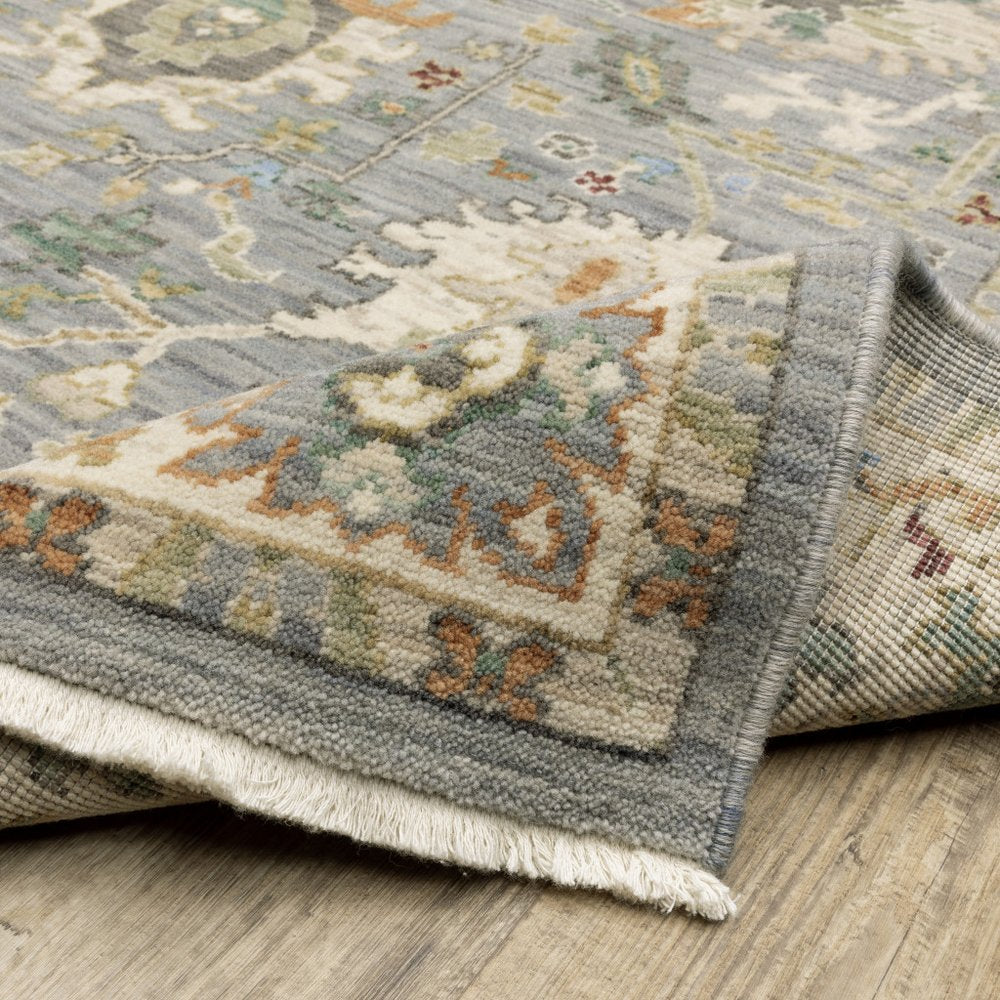 8' X 11' Grey Ivory Orange Teal Green Charcoal Blue And Red Oriental Power Loom Stain Resistant Area Rug With Fringe