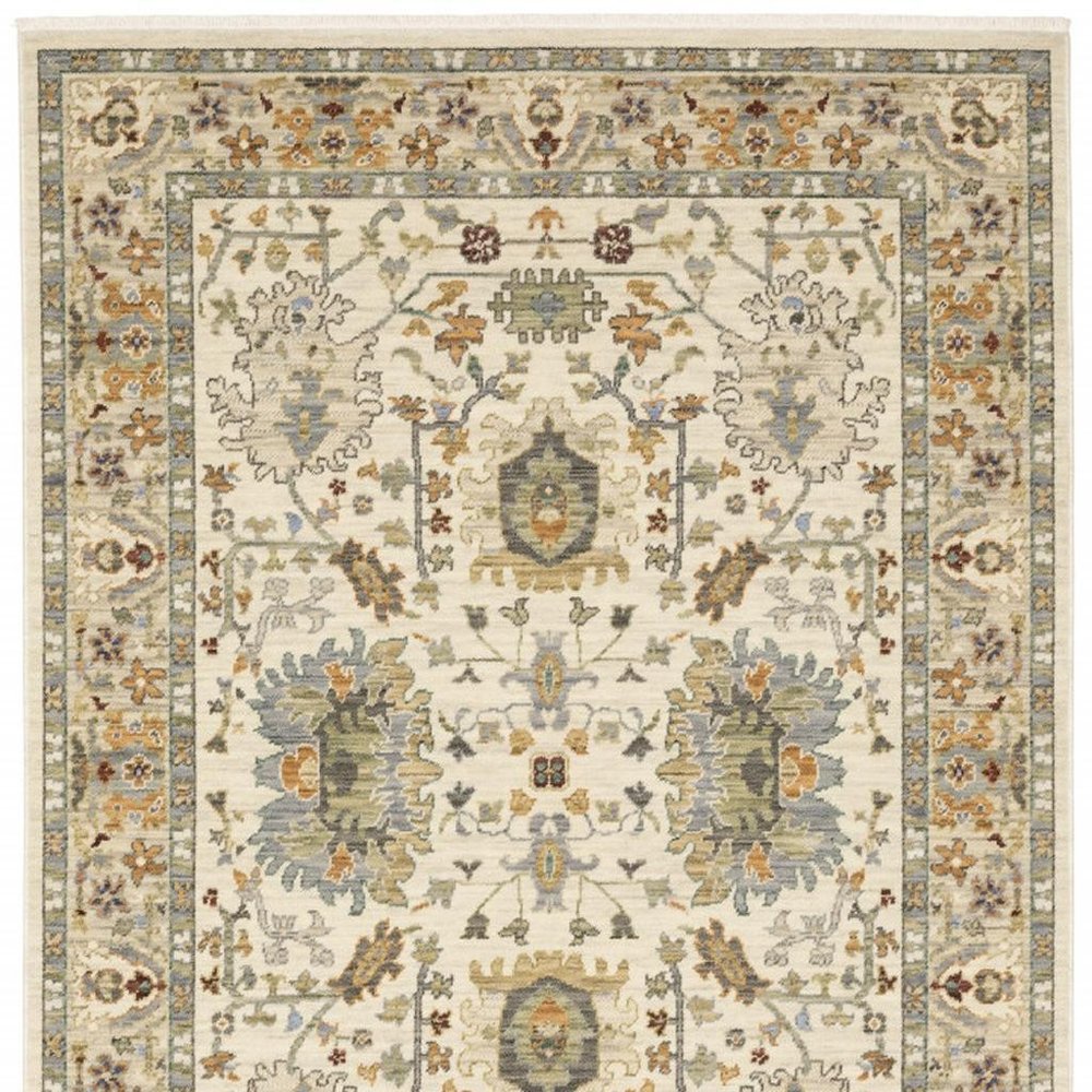 2' X 6' Ivory Grey Orange Green Blue And Red Oriental Power Loom Stain Resistant Runner Rug With Fringe