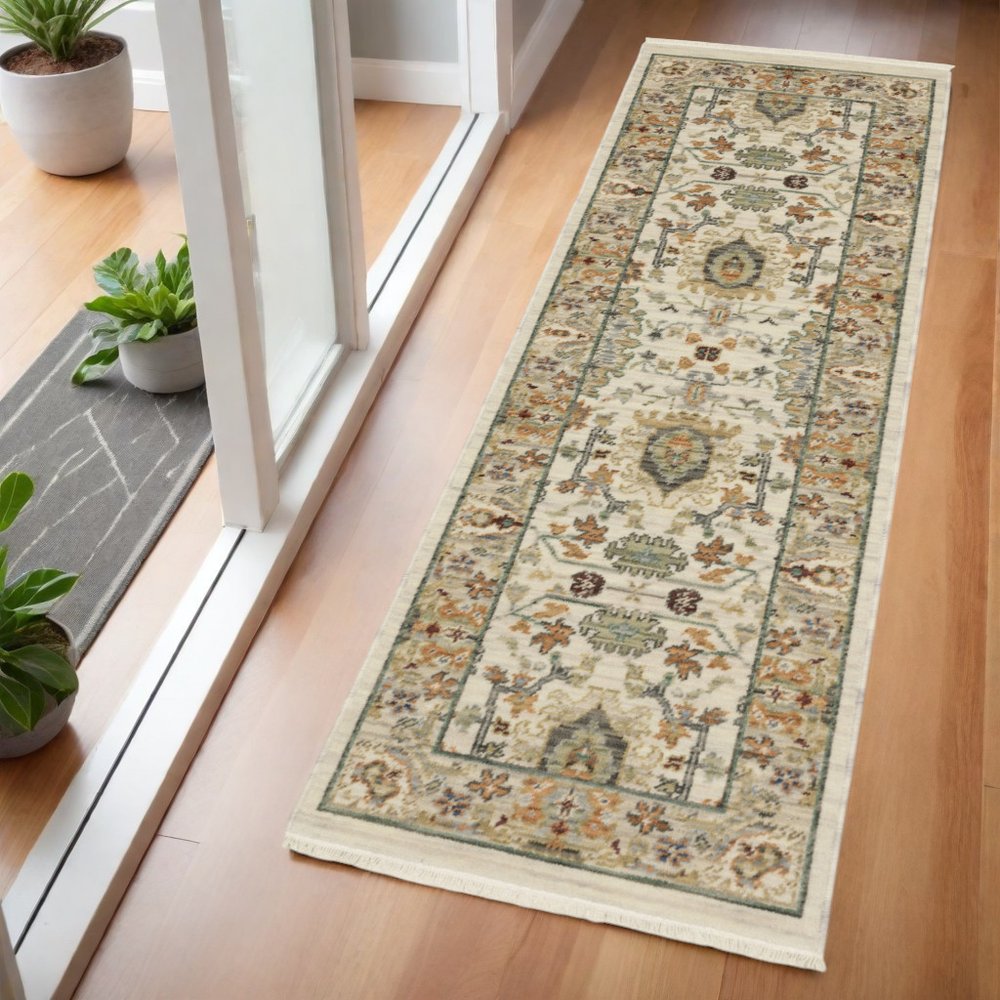 2' X 6' Ivory Grey Orange Green Blue And Red Oriental Power Loom Stain Resistant Runner Rug With Fringe