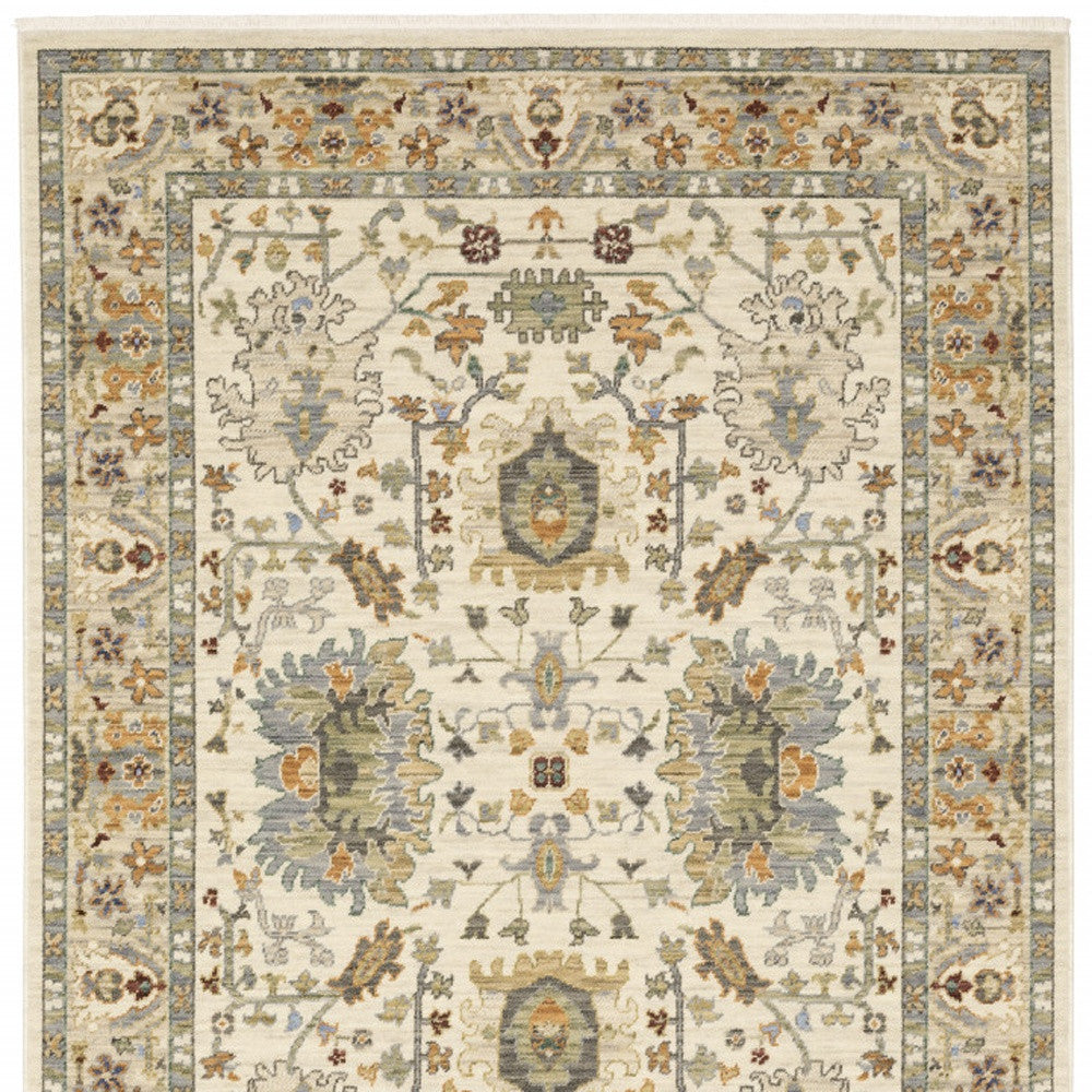 3' X 5' Ivory Grey Orange Green Blue And Red Oriental Power Loom Stain Resistant Area Rug With Fringe