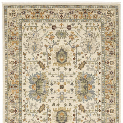 3' X 5' Ivory Grey Orange Green Blue And Red Oriental Power Loom Stain Resistant Area Rug With Fringe