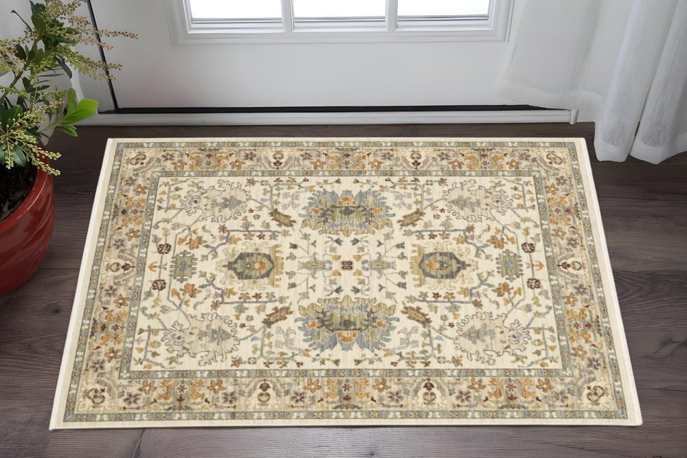 3' X 5' Ivory Grey Orange Green Blue And Red Oriental Power Loom Stain Resistant Area Rug With Fringe