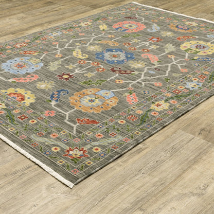 6' X 9' Grey Blue Pink Orange Rust Red Green And Ivory Oriental Power Loom Stain Resistant Area Rug With Fringe