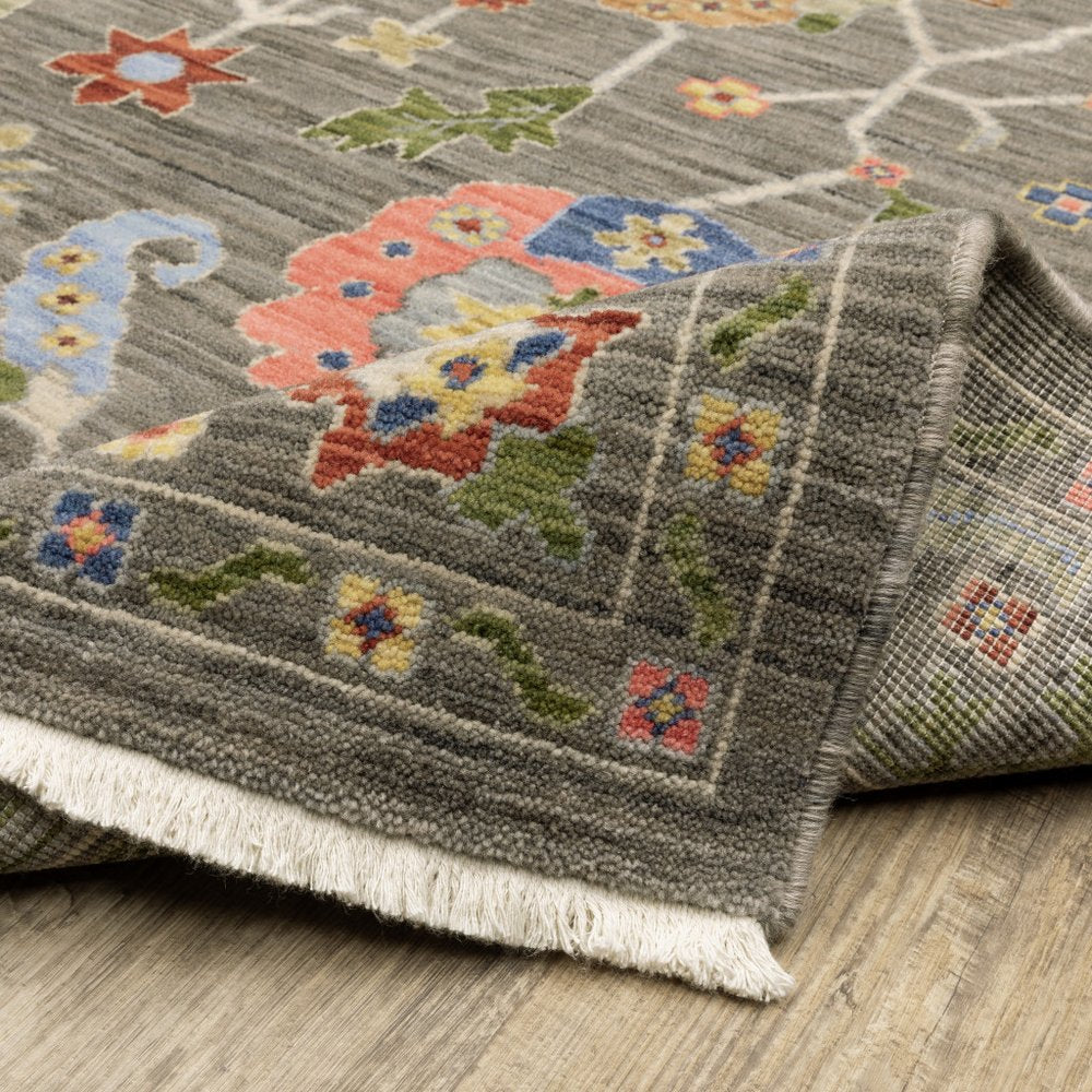 6' X 9' Grey Blue Pink Orange Rust Red Green And Ivory Oriental Power Loom Stain Resistant Area Rug With Fringe
