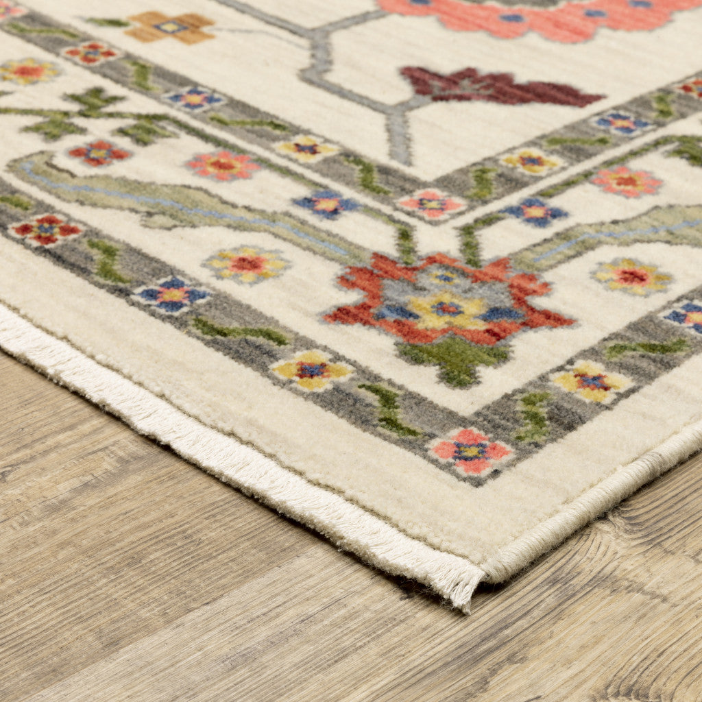 3' X 5' Ivory Green Blues Pink Yellow Rust Brown Tan And Grey Oriental Power Loom Stain Resistant Area Rug With Fringe