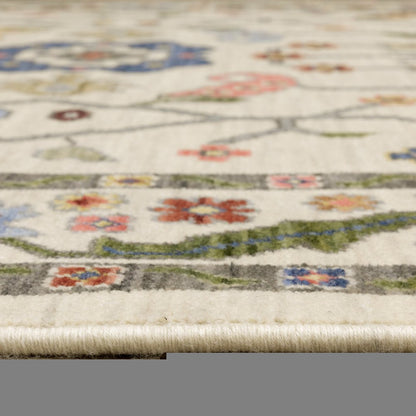 3' X 5' Ivory Green Blues Pink Yellow Rust Brown Tan And Grey Oriental Power Loom Stain Resistant Area Rug With Fringe