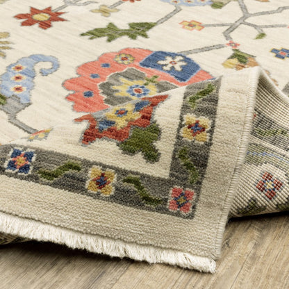 10' X 13' Ivory Green Blues Pink Yellow Rust Brown Tan And Grey Oriental Power Loom Stain Resistant Area Rug With Fringe