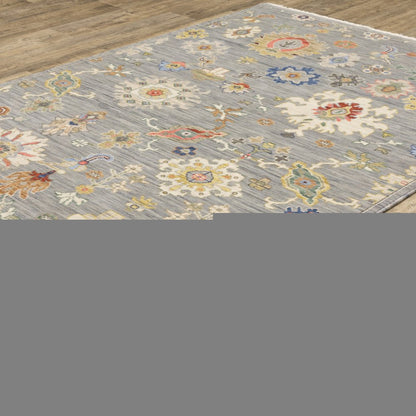 3' X 5' Grey Ivory Gold Salmon Red Blue And Green Oriental Power Loom Stain Resistant Area Rug With Fringe