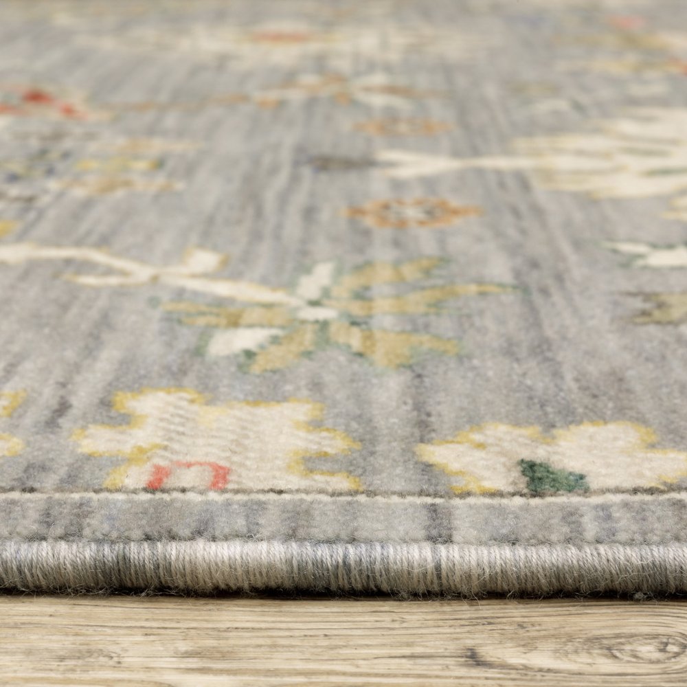 10' X 13' Grey Ivory Gold Salmon Red Blue And Green Oriental Power Loom Stain Resistant Area Rug With Fringe