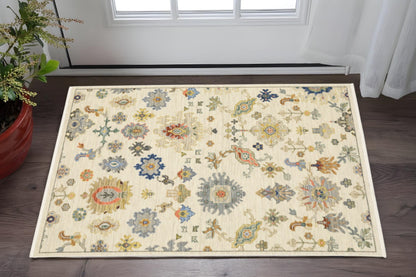 2' X 3' Ivory Beige Gold Grey Blue Pink Red Rust And Green Oriental Power Loom Stain Resistant Area Rug With Fringe
