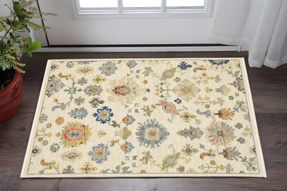 2' X 3' Ivory Beige Gold Grey Blue Pink Red Rust And Green Oriental Power Loom Stain Resistant Area Rug With Fringe