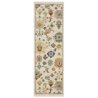 2' X 6' Ivory Beige Gold Grey Blue Pink Red Rust And Green Oriental Power Loom Stain Resistant Runner Rug With Fringe