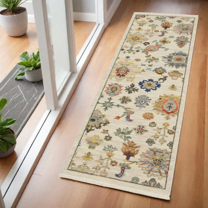 2' X 6' Ivory Beige Gold Grey Blue Pink Red Rust And Green Oriental Power Loom Stain Resistant Runner Rug With Fringe