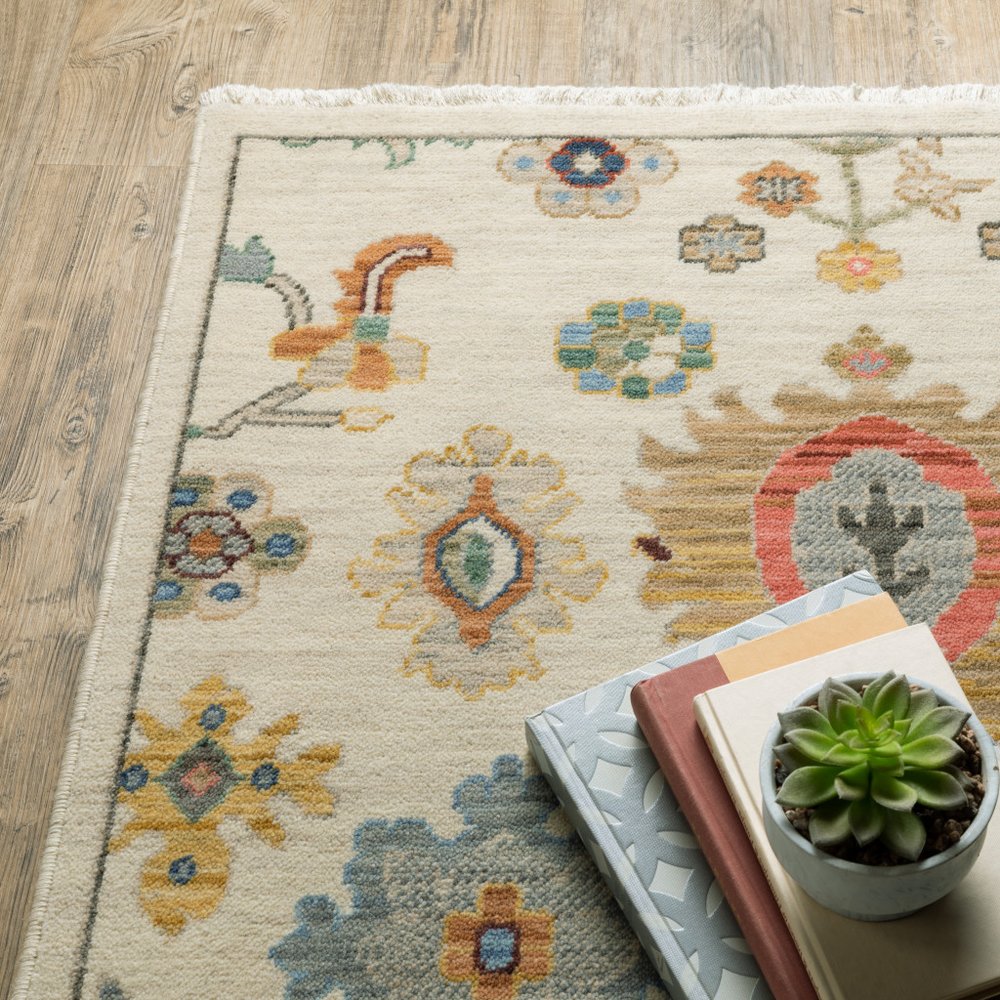 5' X 8' Ivory Beige And Blue Oriental Area Rug With Fringe