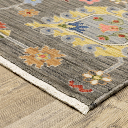 2' X 3' Grey Charcoal Yellow Blue Rust Red Pink Green And Ivory Oriental Power Loom Stain Resistant Area Rug With Fringe