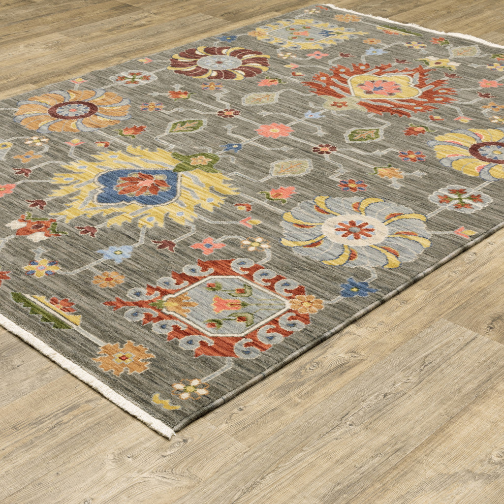 2' X 3' Grey Charcoal Yellow Blue Rust Red Pink Green And Ivory Oriental Power Loom Stain Resistant Area Rug With Fringe