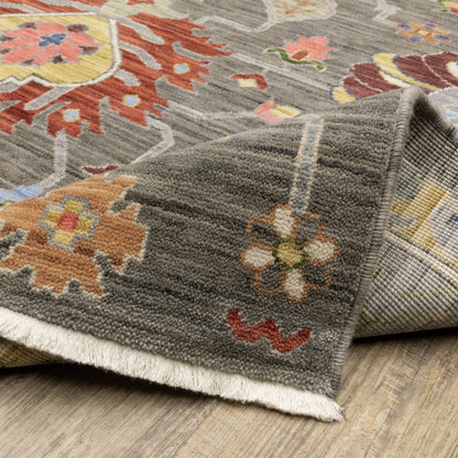 3' X 5' Grey Charcoal Yellow Blue Rust Red Pink Green And Ivory Oriental Power Loom Stain Resistant Area Rug With Fringe