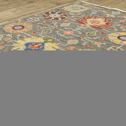 8' X 11' Grey Charcoal Yellow Blue Rust Red Pink Green And Ivory Oriental Power Loom Stain Resistant Area Rug With Fringe