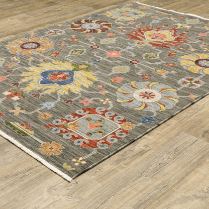 10' X 13' Grey Charcoal Yellow Blue Rust Red Pink Green And Ivory Oriental Power Loom Stain Resistant Area Rug With Fringe