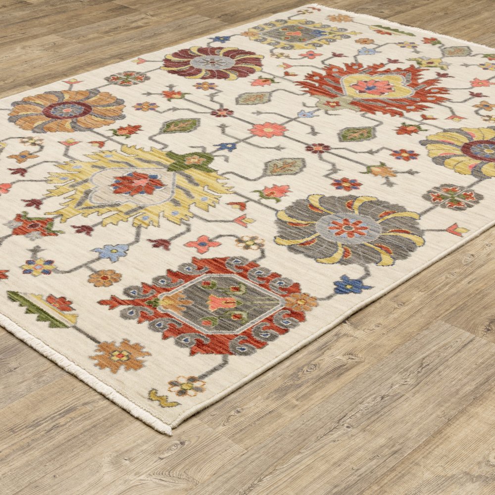 3' X 5' Ivory Yellow Rust Green Grey Pink Orange Blue And Grey Oriental Power Loom Stain Resistant Area Rug With Fringe