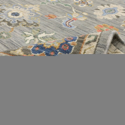 3' X 5' Blue Grey Gold Green Pink Orange Ivory And Red Oriental Power Loom Stain Resistant Area Rug With Fringe