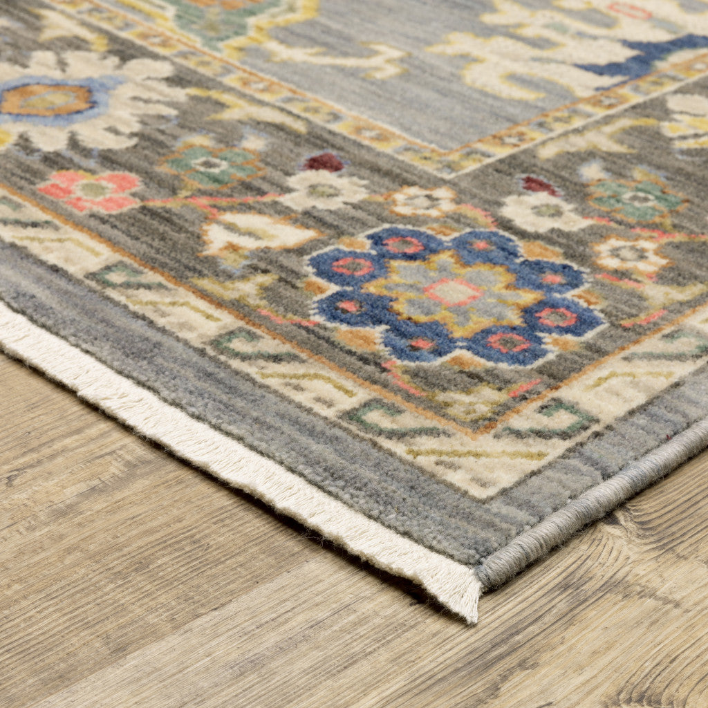 5' X 8' Blue Grey Gold Green Pink Orange Ivory And Red Oriental Power Loom Stain Resistant Area Rug With Fringe