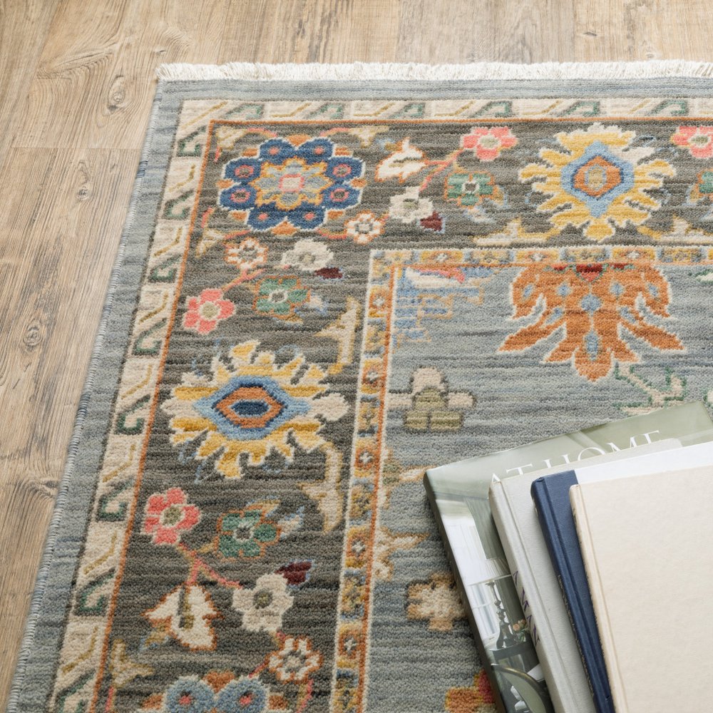 5' X 8' Blue Ivory And Red Oriental Area Rug With Fringe