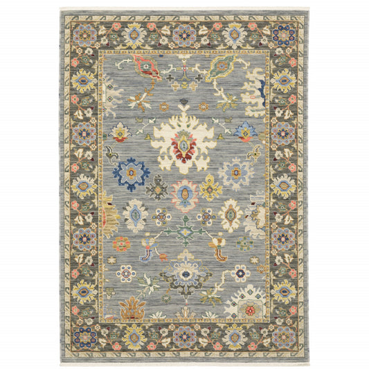 6' X 9' Blue Grey Gold Green Pink Orange Ivory And Red Oriental Power Loom Stain Resistant Area Rug With Fringe