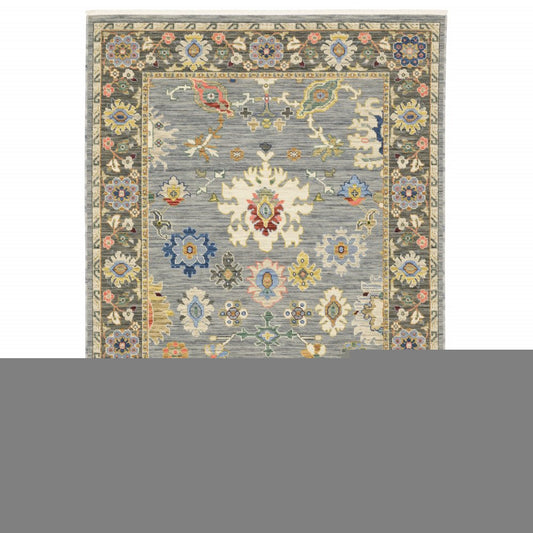 10' X 13' Blue Grey Gold Green Pink Orange Ivory And Red Oriental Power Loom Stain Resistant Area Rug With Fringe