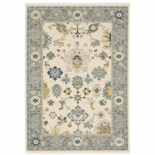 2' X 3' Ivory Blue Grey Teal Gold Green And Rust Oriental Power Loom Stain Resistant Area Rug With Fringe