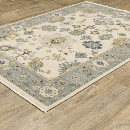 2' X 3' Ivory Blue Grey Teal Gold Green And Rust Oriental Power Loom Stain Resistant Area Rug With Fringe