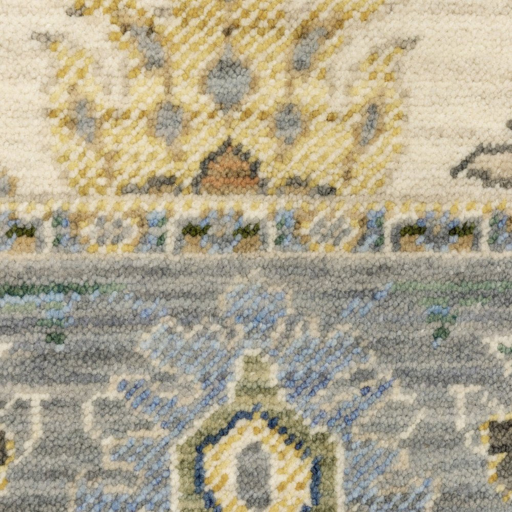 2' X 3' Ivory Blue Grey Teal Gold Green And Rust Oriental Power Loom Stain Resistant Area Rug With Fringe