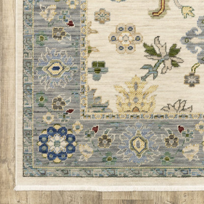 2' X 3' Ivory Blue Grey Teal Gold Green And Rust Oriental Power Loom Stain Resistant Area Rug With Fringe