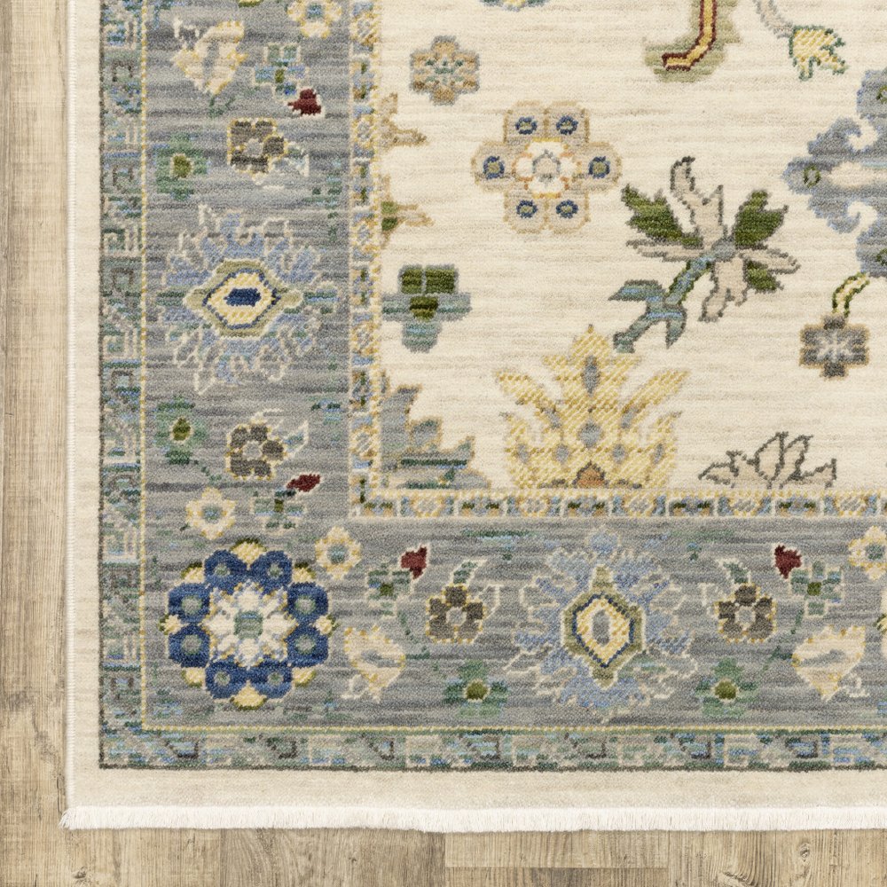 2' X 3' Ivory Blue Grey Teal Gold Green And Rust Oriental Power Loom Stain Resistant Area Rug With Fringe