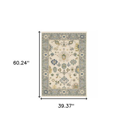 3' X 5' Ivory Blue Grey Teal Gold Green And Rust Oriental Power Loom Stain Resistant Area Rug With Fringe