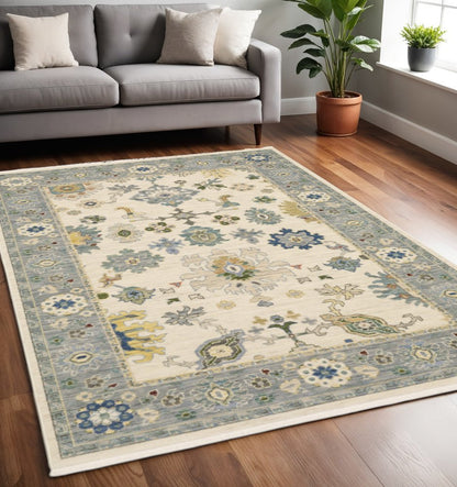 5' X 8' Ivory And Blue Oriental Area Rug With Fringe
