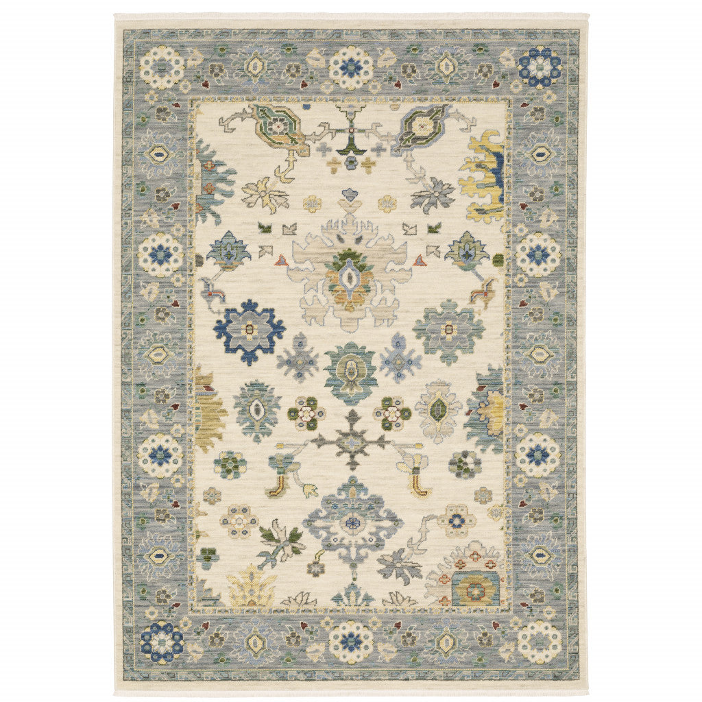 6' X 9' Ivory Blue Grey Teal Gold Green And Rust Oriental Power Loom Stain Resistant Area Rug With Fringe