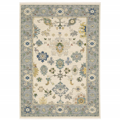 6' X 9' Ivory Blue Grey Teal Gold Green And Rust Oriental Power Loom Stain Resistant Area Rug With Fringe