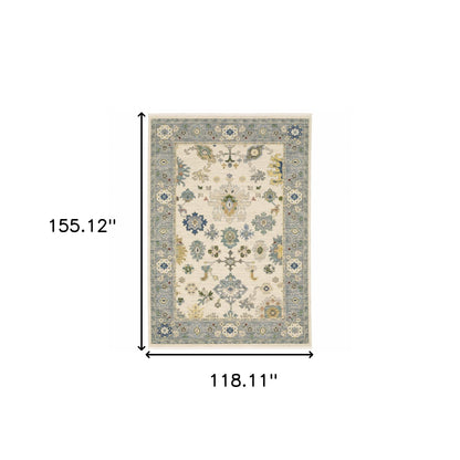 10' X 13' Ivory Blue Grey Teal Gold Green And Rust Oriental Power Loom Stain Resistant Area Rug With Fringe