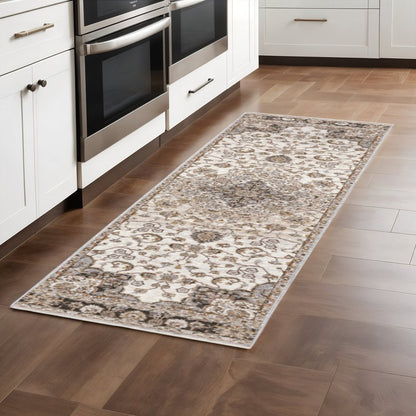 2' X 8' Ivory And Blue Oriental Power Loom Stain Resistant Runner Rug With Fringe