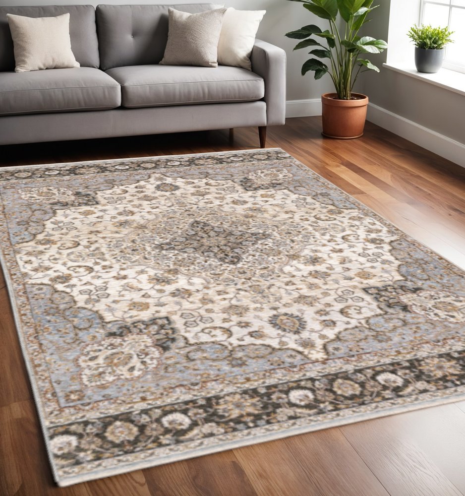 5' X 8' Ivory And Blue Oriental Power Loom Stain Resistant Area Rug With Fringe